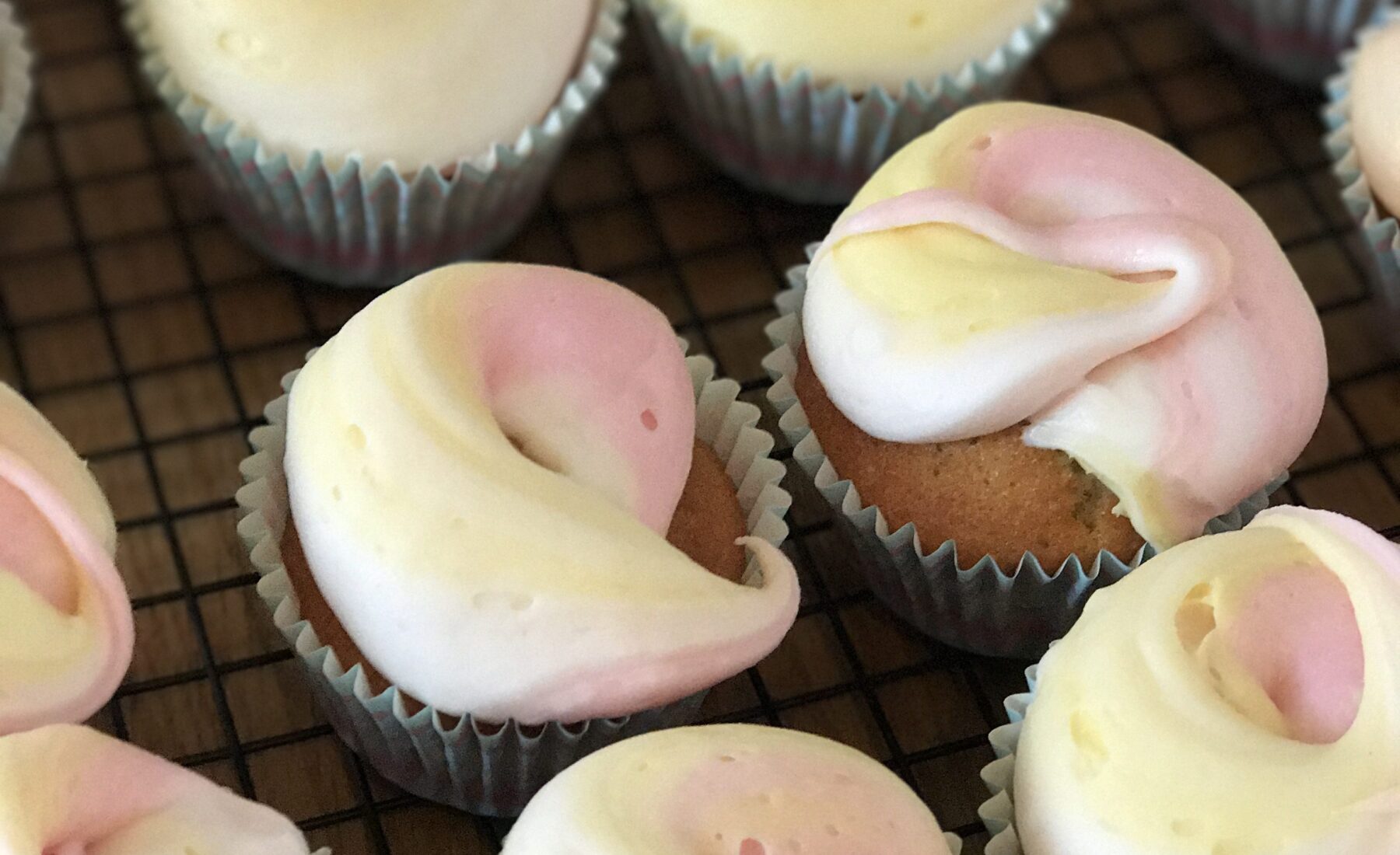 Swirly rainbow iced cupcakes